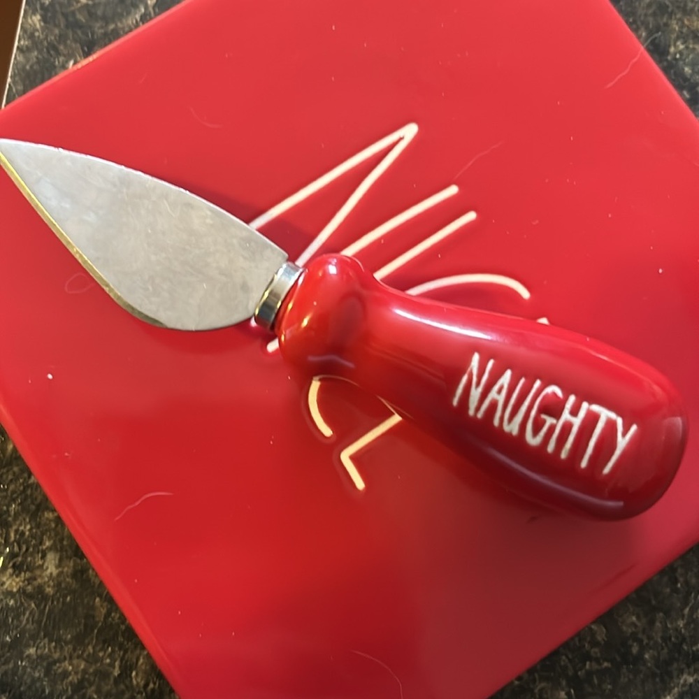 Rae Dunn Naughty/Nice Red Inside Mug with Red cheese plate and knife.